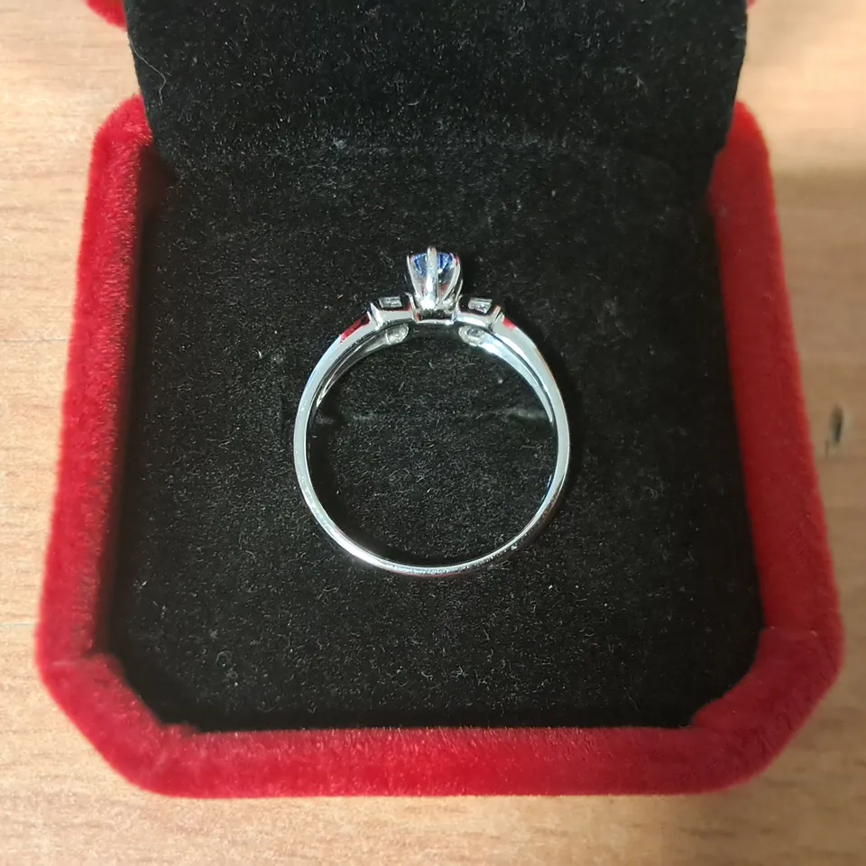 18CT WHITE GOLD RING SET WITH A TANZANITE AND NATURAL BAGUETTE CUT DIAMOND