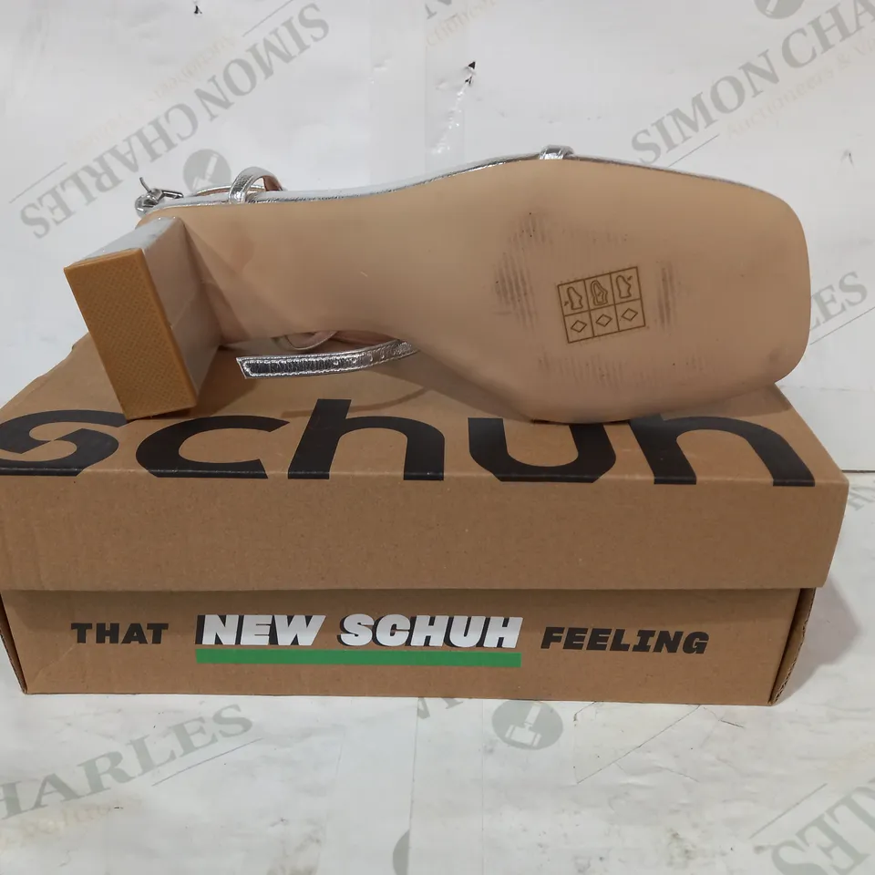 BOXED PAIR OF SCHUH HEELED SANDALS IN METALLIC SILVER COLOUR UK SIZE 7
