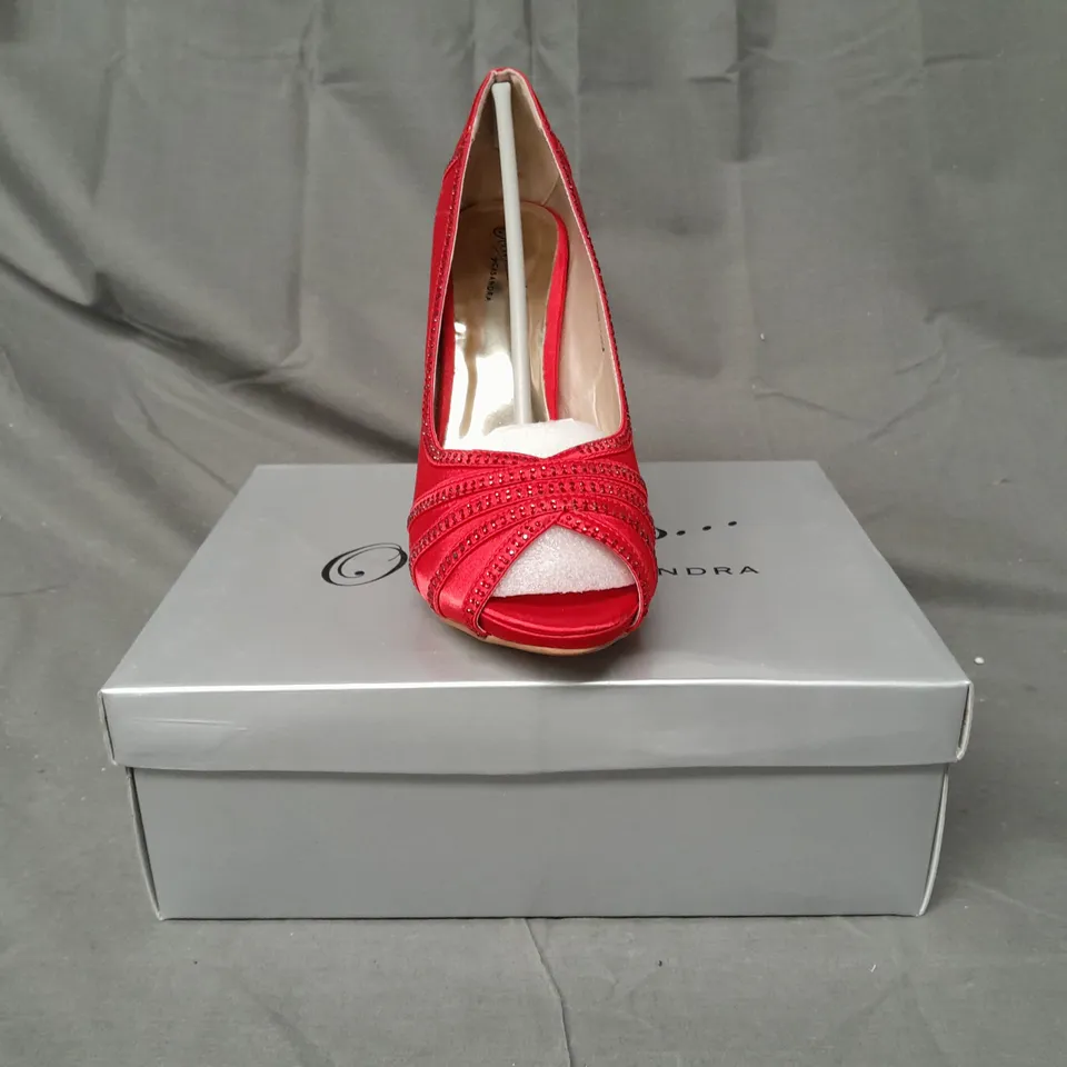 BOX OF APPROXIMATELY 10 BOXED PAIRS OF OCCASIONS BY CASANDRA PEEP TOE HIGH HEEL SHOES IN RED SATIN W. JEWEL EFFECT - VARIOUS SIZES