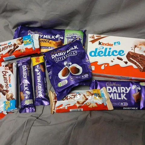 APPROXIMATELY 12 ASSORTED CHOCOLATE FOOD ITEMS TO INCLUDE KINDER DELICE, DAIRY MILK BAR, KINDER BUENO, ETC