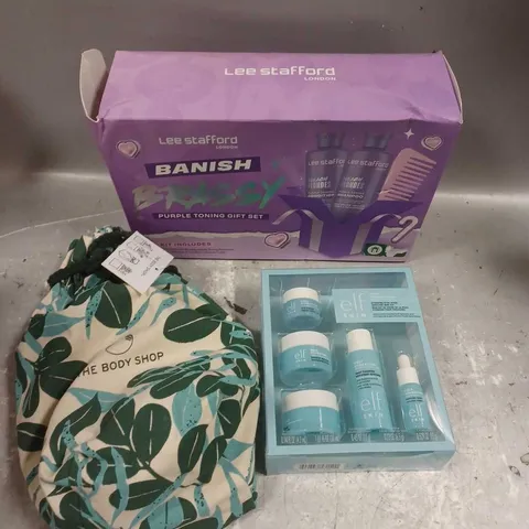 LOT OF 3 ASSORTED COSMETIC BOXSETS TO INCLUDE - LEE STAFFORD BANISH BRASSY PURPLE TONING GIFT SET - THE BODY SHOP BODY COLLECTION - ELF SKIN HOLY HYDRATION SKINCARE SET