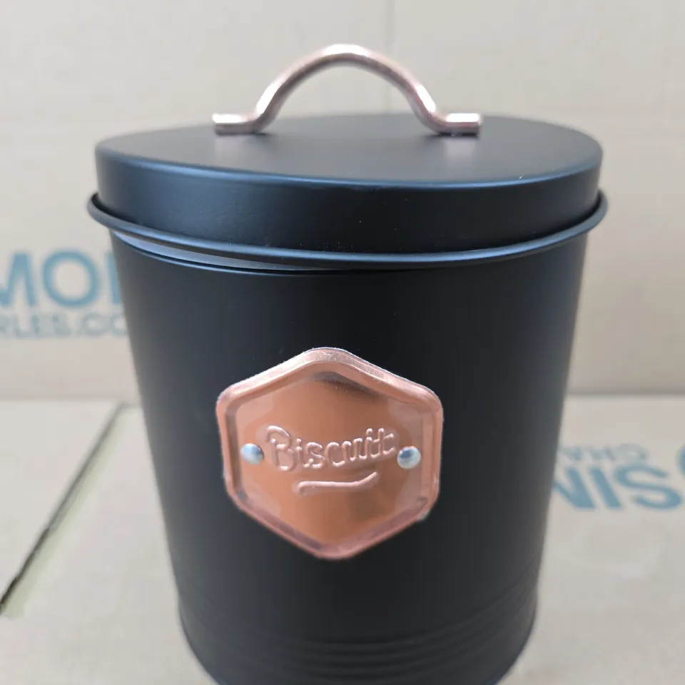 BLACK BISCUIT TIN WITH COPPER PLAQUE 