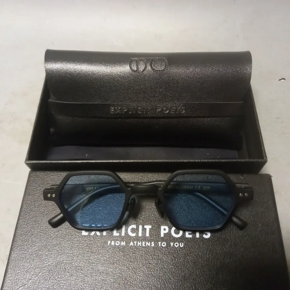 BOXED PAIR OF EXPLICIT POETS BLACK FRAMED GLASSES