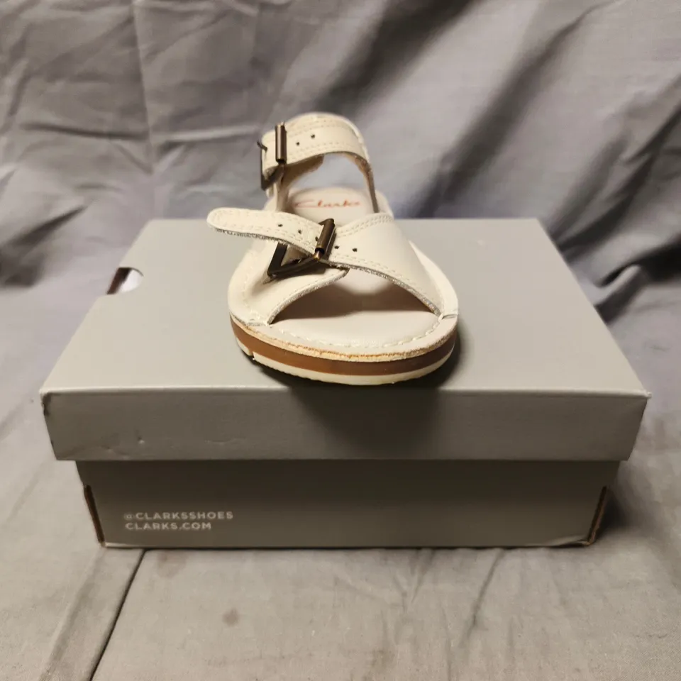 BOXED PAIR OF CLARKS KIDS OPEN TOE SANDALS IN OFF-WHITE SIZE UK 7.5