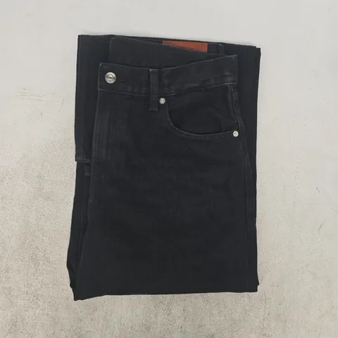 CALVIN KLEIN JEANS IN BLACK SIZE 29/31