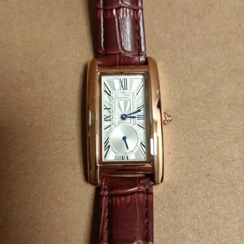 BOXED STOCKWELL RECTANGULAR GOLD-TONE WRISTWATCH WITH BURGUNDY CROCODILE-PATTERN LEATHER STRAP