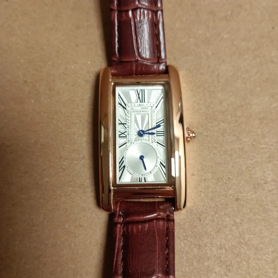 BOXED STOCKWELL RECTANGULAR GOLD-TONE WRISTWATCH WITH BURGUNDY CROCODILE-PATTERN LEATHER STRAP