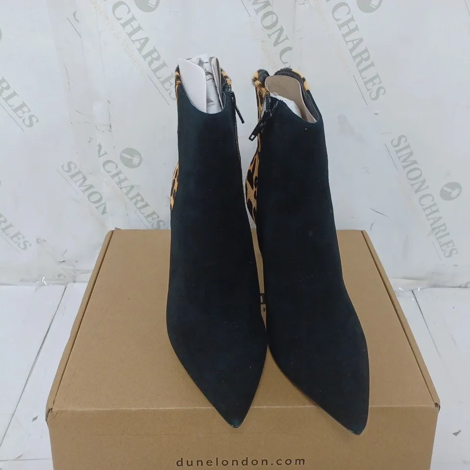 BOXED PAIR OF DUNE HEELED BOOTS IN LEOPARD SIZE 6