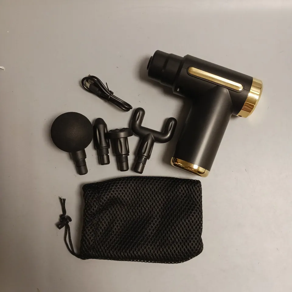 COTSCO MASSAGE GUN IN BLACK WITH GOLD ACCENTS INCLUDES 4 DIFFERENT HEADS AN CHARGING CABLE