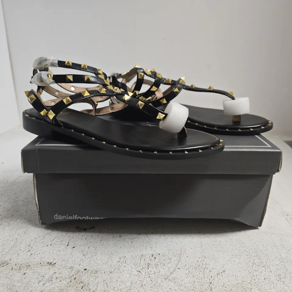 BOXED PAIR OF DANIEL TOE-POST STRAPPY SANDALS IN BLACK W. GOLD STUDS SIZE EU 39
