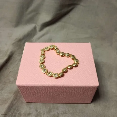 SWAROVSKI GOLD-TONE BRACELET WITH CRYSTAL PAVÉ DISCS