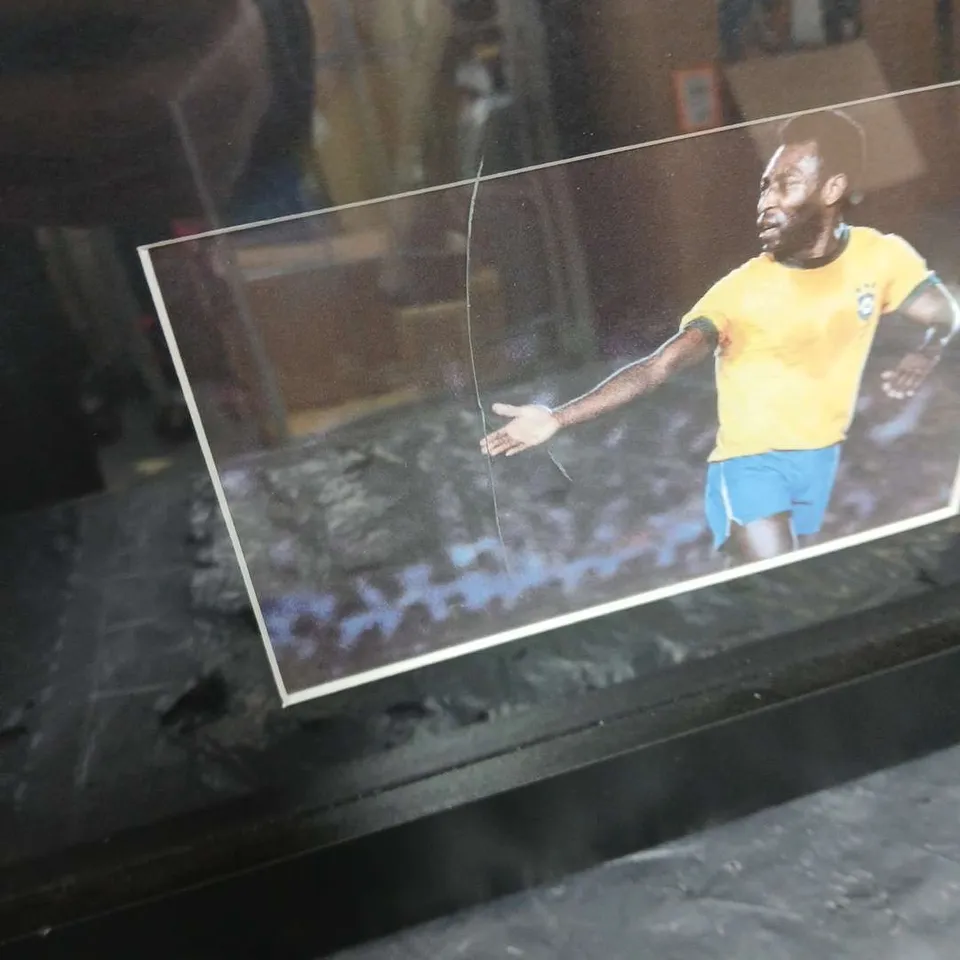 FRAMED PELE PRESENTATION WITH THE ICONIC #10 BRAZIL SHIRT SIGNED 