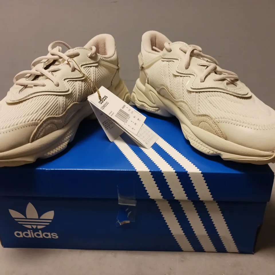BOXED PAIR OF ADIDAS OZWEEGO SHOES IN BEIGE UK SIZE 9