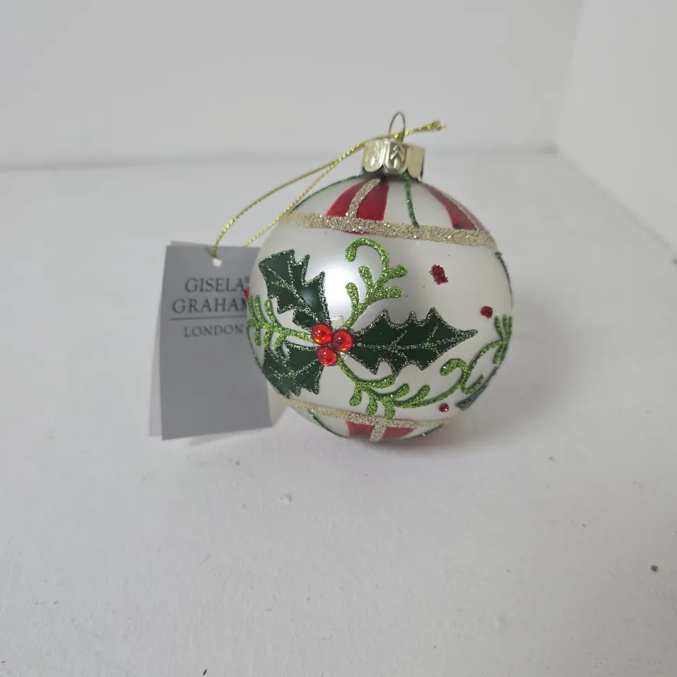 APPROXIMATELY 12 GISELA GRAHAM HOLLY GLASS BAUBLES FEATURING HAND-PAINTED HOLLY LEAVES AND BERRIES
