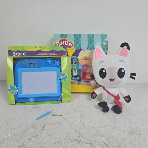 APPROXIMATELY 10 ASSORTED TOYS & GAMES PRODUCTS TO INCLUDE GABBYS DOLLHOUSE PLUSH, STITCH MAGNETIC WRITING BOARD, PLAYDOH SET, ETC