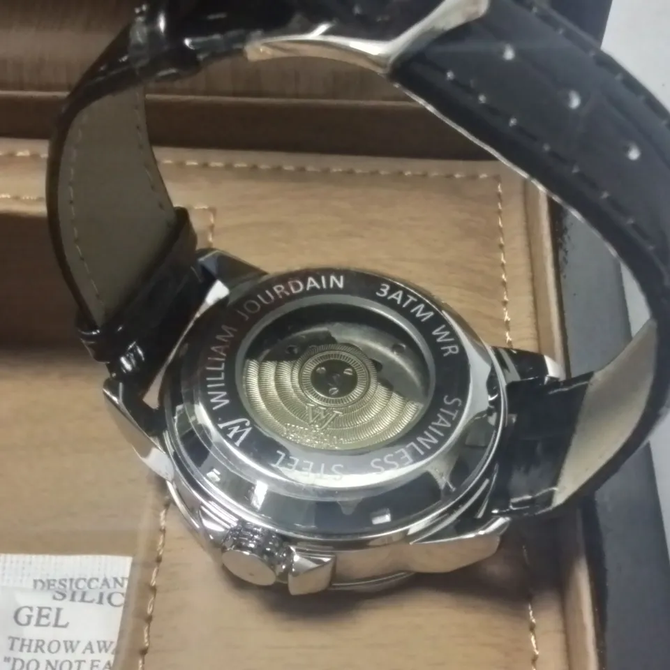 WILLIAM JOURDAIN STAINLESS STEEL GENTS CHRONOGRAPH WATCH WITH SKELETON BACK AND BLACK LEATHER STRAP IN WOODEN GIFT BOX