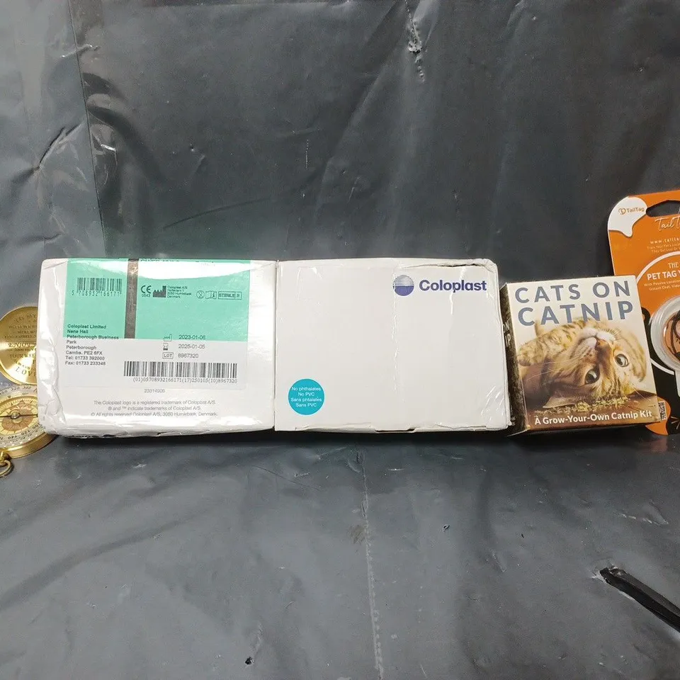 BOX OF APPROXIMATELY 12 ASSORTED ITEMS TO INCLUDE - CATS ON CATNIP , PET TAG YOU NEED , COMPASS ETC