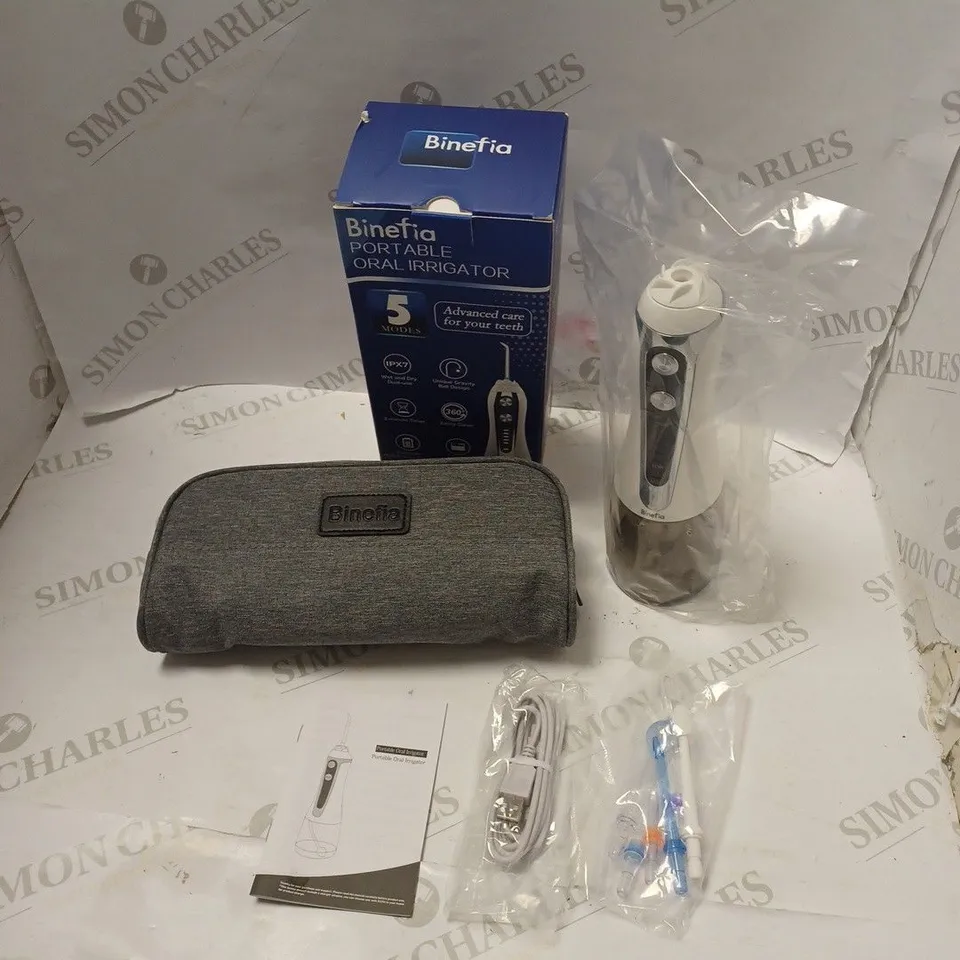 BOXED BINEFIA PORTABLE ORAL IRRIGATOR WITH ACCESSORIES, CARRY CASE, USB CABLE AND USER MANUAL