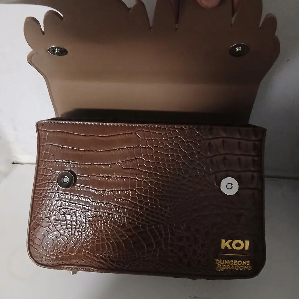 KOI X DUNGEONS & DRAGONS HANDBAG – BROWN FAUX CROCODILE WITH TOOTHY MOUTH DESIGN