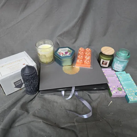 APPROXIMATELY 12 ASSORTED HOUSEHOLD ITEMS TO INCLUDE SCENTED CANDLES & WAX MELTS