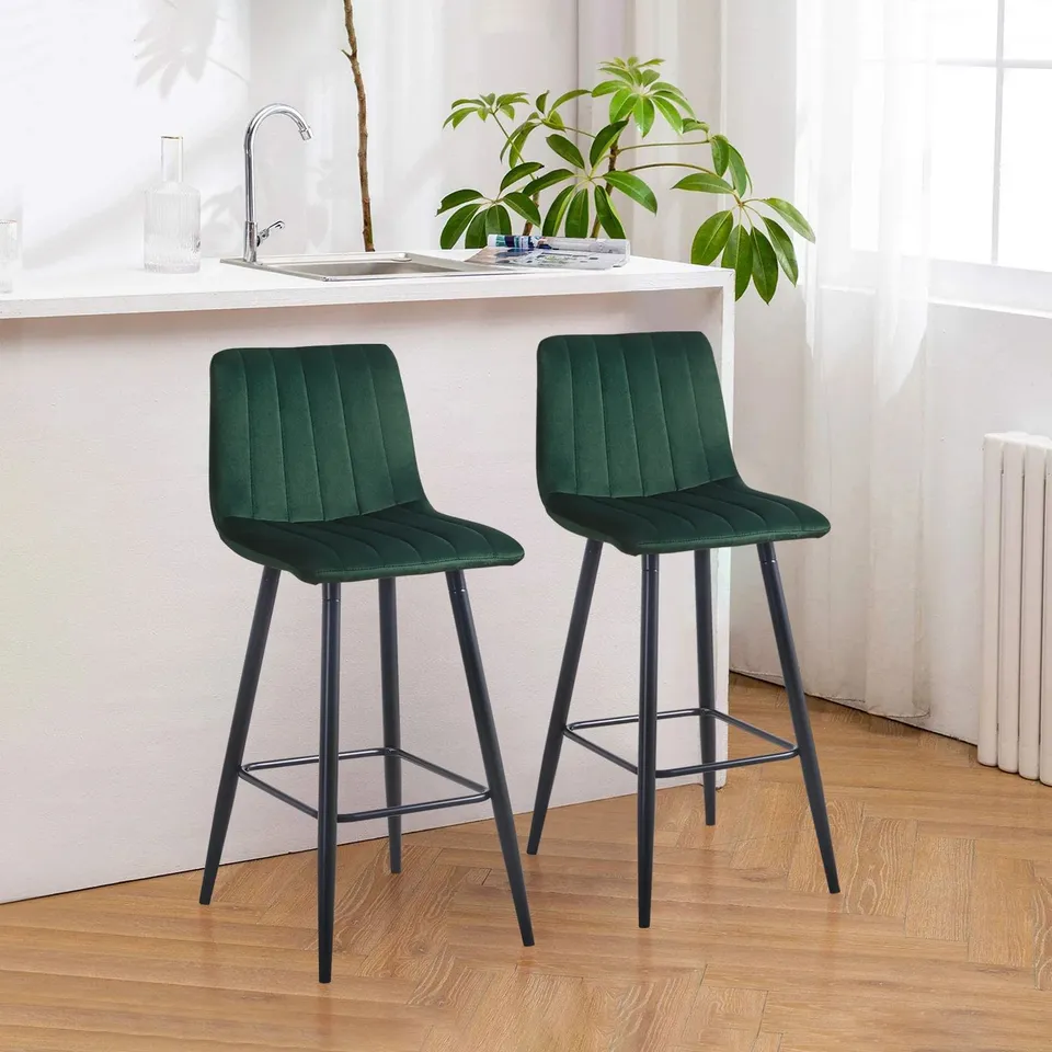 A BOXED PAIR OF DARK GREEN VELVET UPHOLSTERED DINING ROOM CHAIRS 