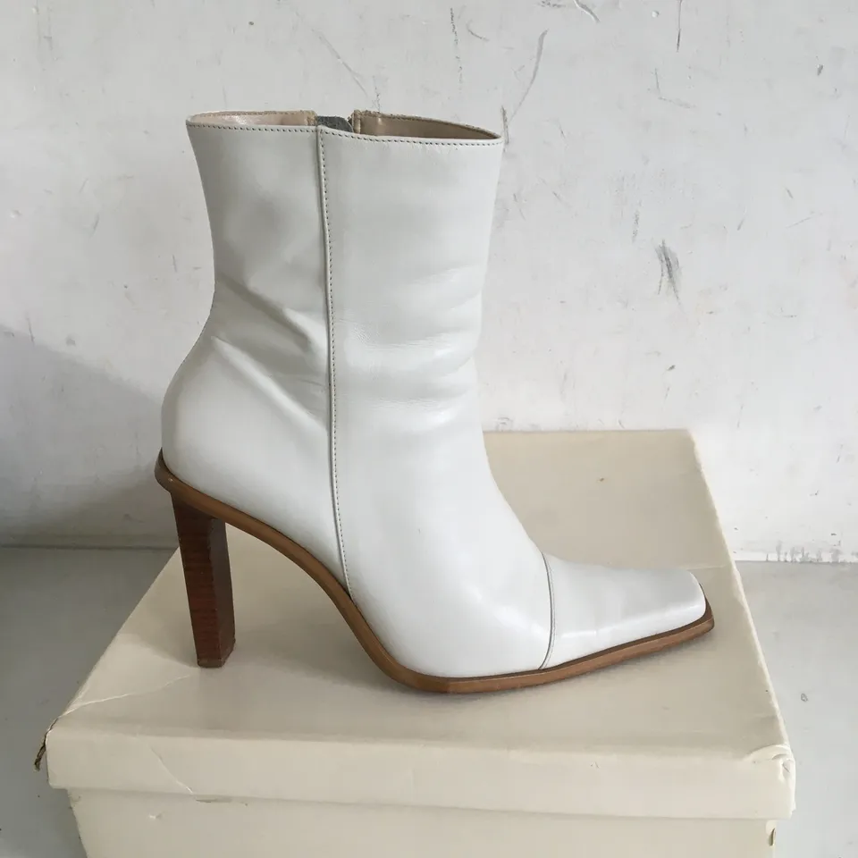 BOXED PAIR OF SIZE 7 HIGH HEEL BOOTS