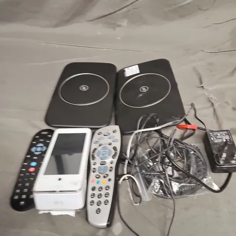 TOTE OF APPROXIMATELY 10 ASSORTED HOUSEHOLD ITEM TO INCLUDE ROUTERS, TV REMOTES AND CARD READERS