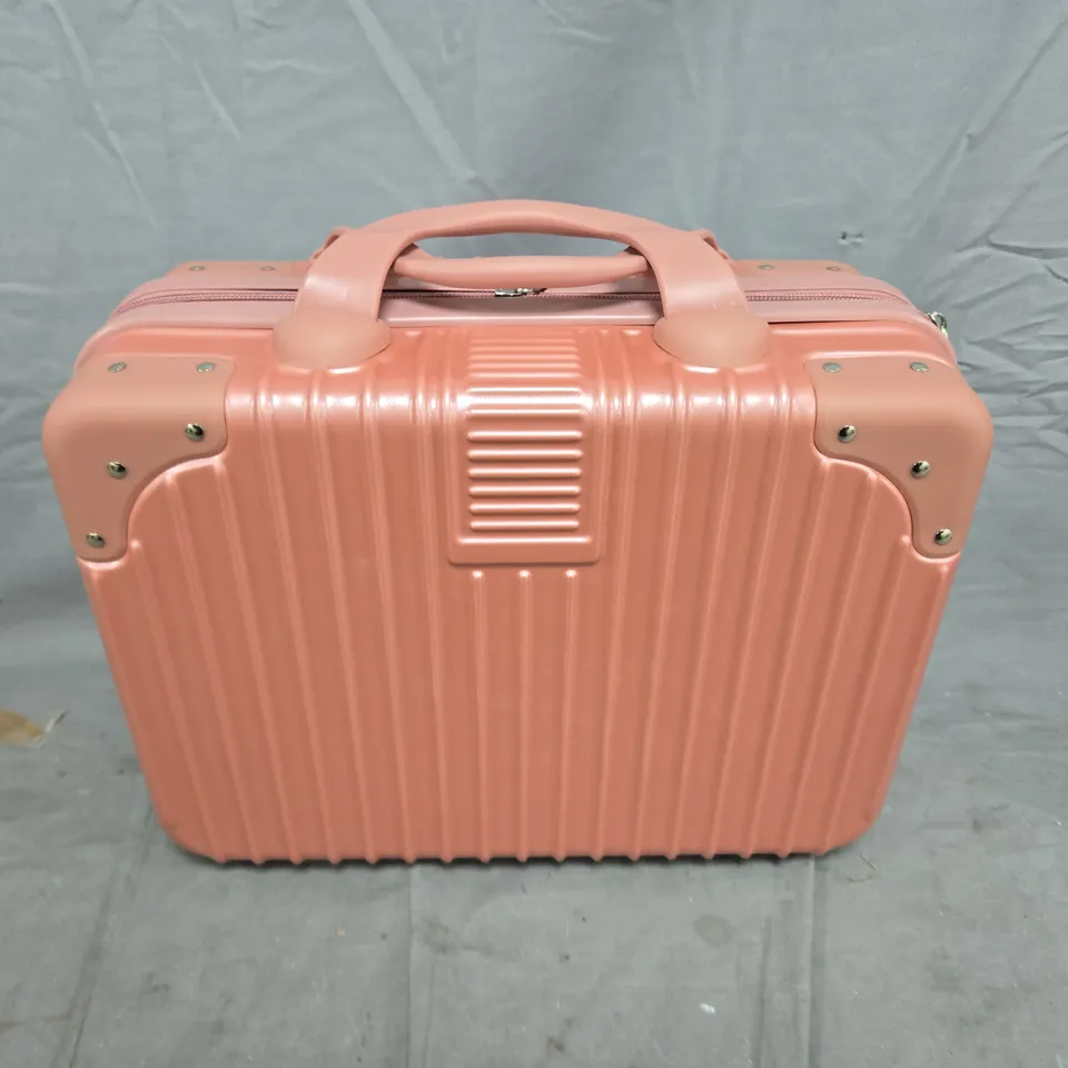 PINK HARD-SHELL SUITCASE WITH RIBBED EXTERIOR