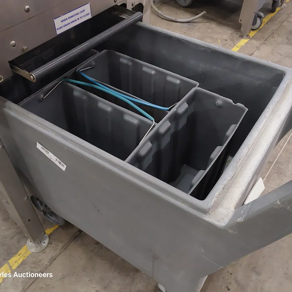 FOLLETT COMMERCIAL ICE MACHINE ON STAND WITH ICE TROLLEY