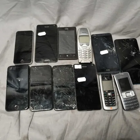 APPROXIMATELY 25 ASSORTED PHONES TO INCLUDE MICROSFT, APPLE IPHONES, NOKIA, ETC