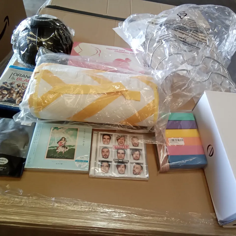 PALLET OF ASSORTED ITEMS INCLUDING PICNIC BLANKET, M-DESIGN PAN LID HOLDER, TIGHTEN HIPS CHARMING CURVES, SQUID GAMES MASKS, BUSTED HALF WAY THERE CD, ORANGE IS THE NEW BLACK SEASON 2 BLURAY