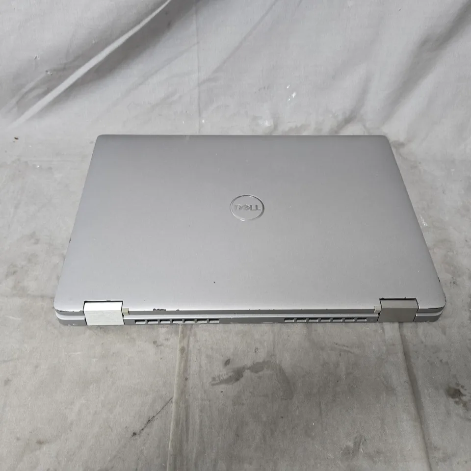 DELL LAPTOP – INTEL CORE I5, SILVER WITH POWER PACK. POWERS ON. MULTIPLE KEYS MISSING