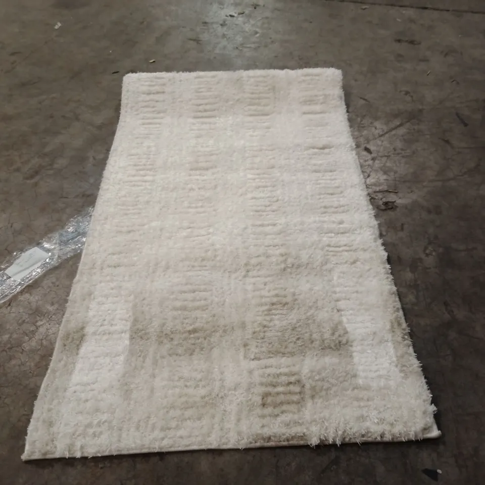 STILLAGE OF APPROXIMATELY 40 DESIGNER RUGS