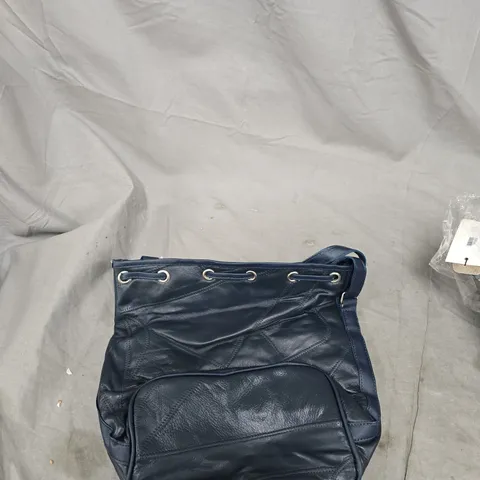 NAVY QUILTED SHOULDER BAG – GROMMET EYELET DETAIL 