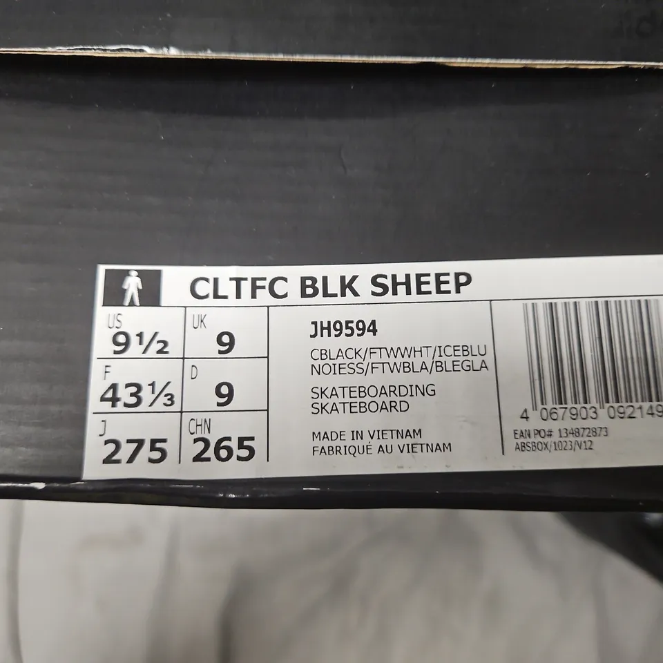 BOXED ADIDAS BLACK SHEEP SNEAKERS – UK 9 (US 9.5), BLACK WITH LIGHT BLUE STRIPES