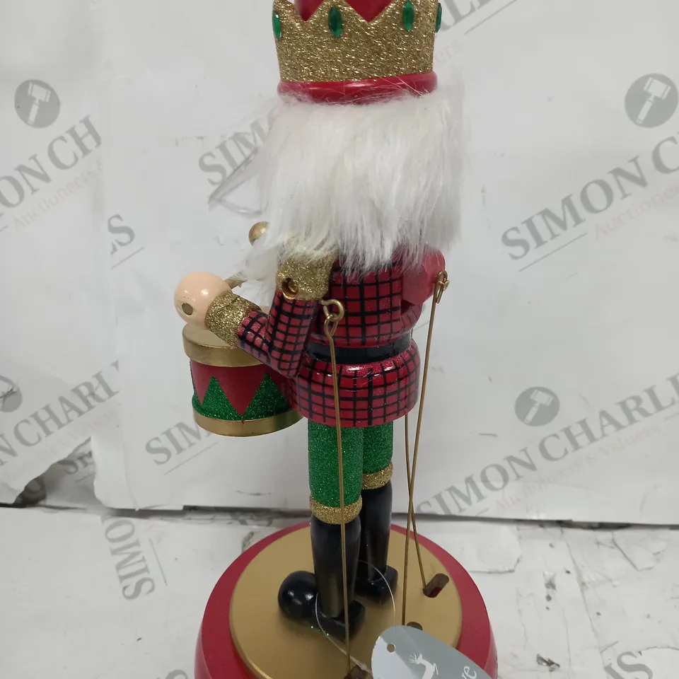 FESTIVE 32CM WOODEN ANIMATED MUSICAL NUTCRACKER
