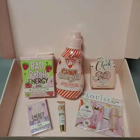 BOX OF APPROXIMATELY 6 ASSORTED PLOUISE COSMETIC PRODUCTS TO INCLUDE - THE CHEEK OF IT BAKED BRONZER - COSMETIC BASE IN SEMI NUDE - CANDY CLEANSE BATH SOAK - ETC