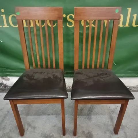 PAIR OF WOODEN DINING CHAIRS WITH BLACK FAUX LEATHER SEAT PADS