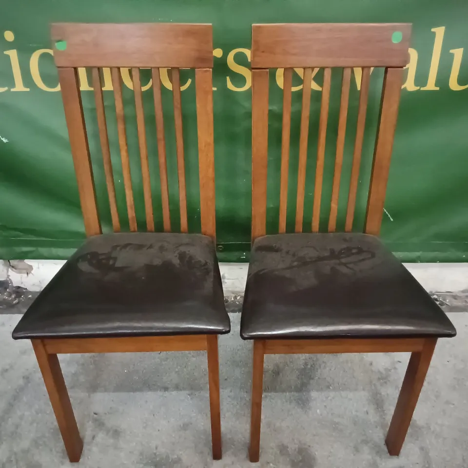 PAIR OF WOODEN DINING CHAIRS WITH BLACK FAUX LEATHER SEAT PADS 