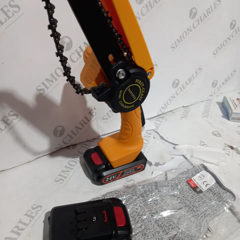BOXED MINI CHAINSAW WITH BATTERIES AND GLOVES
