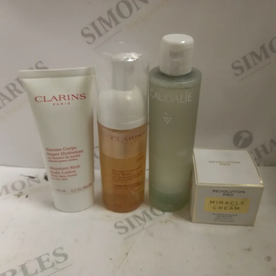 APPROXIMATELY 4 ASSORTED COSMETICS ITEMS TO INCLUDE CLARINS GENTLE RENEWING CLEANSING MOUSSE (150ml), CAUDALIE PURIFYING TONER (200ml), REVOLUTION PRO MIRACLE CREAM (50ml), ETC
