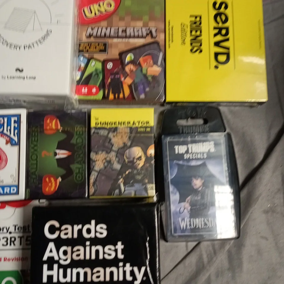 ASSORTED CARD GAMES & PLAYING CARDS TO INCLUDE UNO, BICYCLE, CARDS AGAINST HUMANITY, GCSE REVISION CARDS