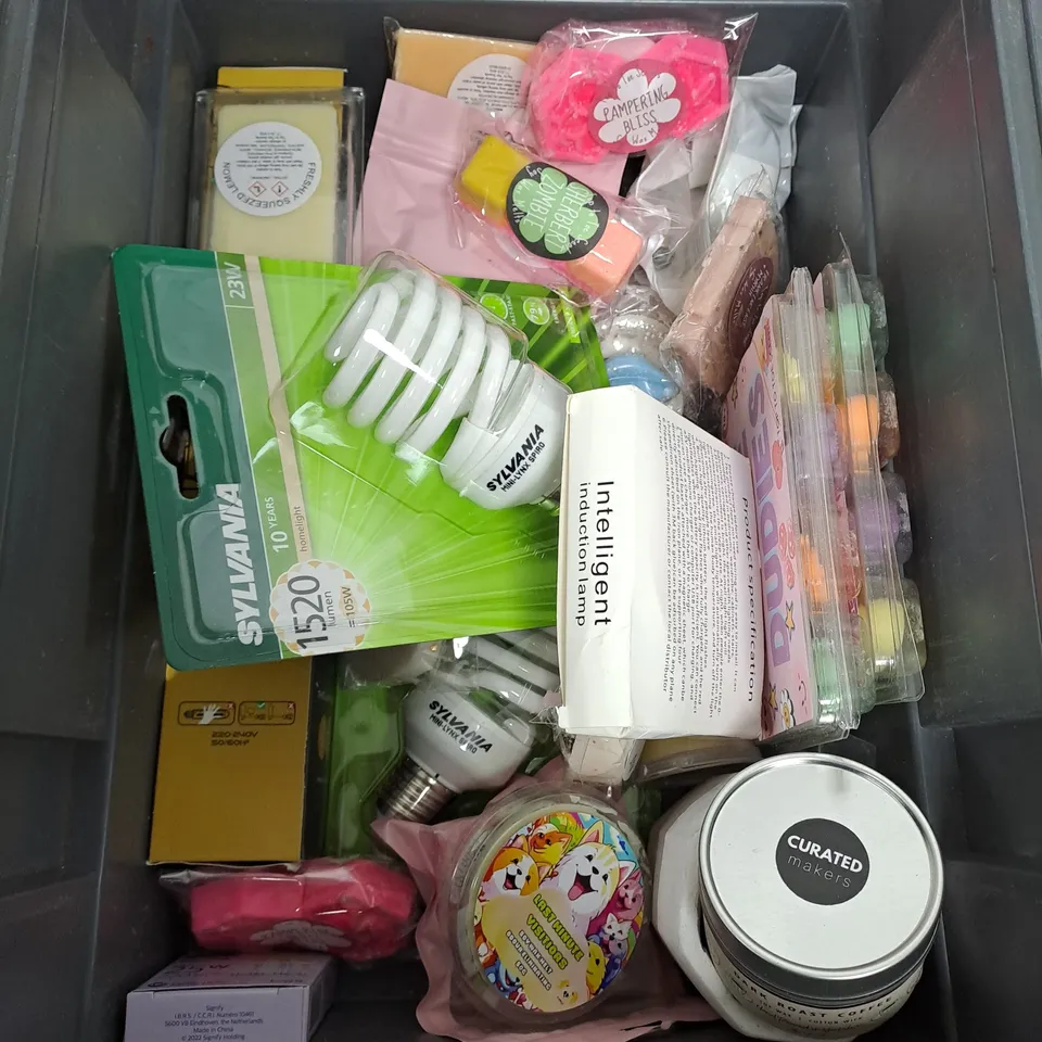 TOTE OF ASSORTED HOUSEHOLD ITEMS TOO INCLUDE CANDLES , WHELK SHELLS , LIGHTBULBS , ETC 