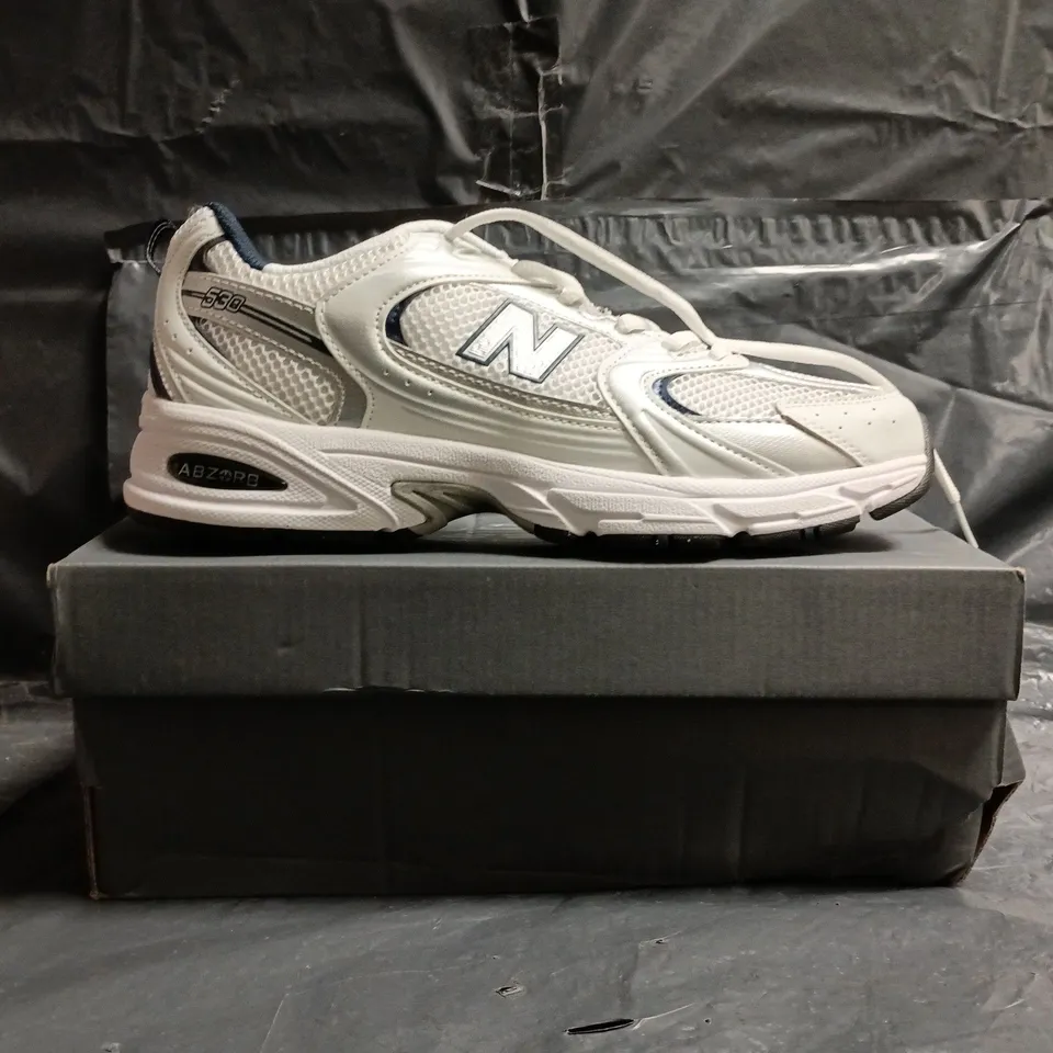 BOXED PAIR OF NEW BALANCE 530 TRAINERS IN WHITE/SILVER/NAVY SIZE UK 10