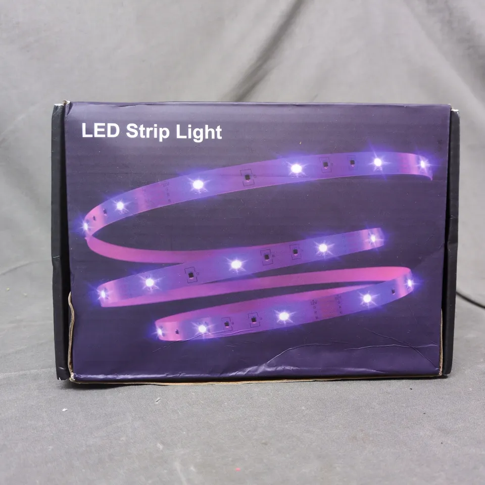 approximately 8 assorted household items to include led strip light, etc