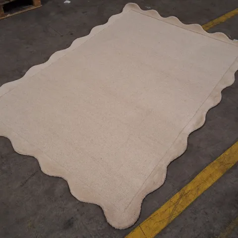 BEIGE RUG WITH SCALLOPED EDGE APPROXIMATELY 160Γ230CM