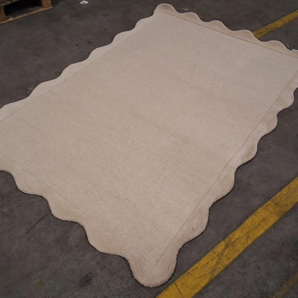 BEIGE RUG WITH SCALLOPED EDGE APPROXIMATELY 160×230CM