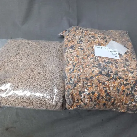 FOUR LARGE BAGS OF BIRD SEED