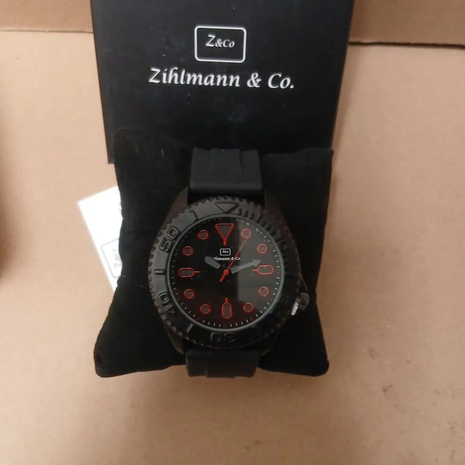 ZIHLMANN & CO. WRISTWATCH – BLACK DIAL WITH RED NUMERALS 
