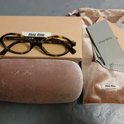 BOXED PAIR OF MIU MIU BROWN PATTERENED GLASSES